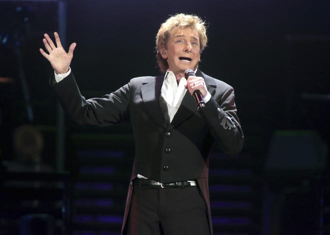 FILE - In this March 17, 2016 file photo, Barry Manilow performs in concert during his "One Last Time! Tour 2016" in Hershey, Pa. The Grammy Award-winning singer of such songs as "Mandy," "I Write the Songs" and "Looks Like We Made It" will appear at the next monthly "Concert for America: Stand Up, Sing Out!" on April 18 at The Town Hall in New York. It also will be streamed live on Facebook. (Photo by Owen Sweeney/Invision/AP, File)