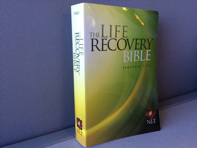 Mathew Vangel and his wife Jackie pass out "The Life Recovery Bible" to people affected by or struggling with addiction. AIMEE CHIAVAROLI / THE STANDARD-TIMES / SCMG