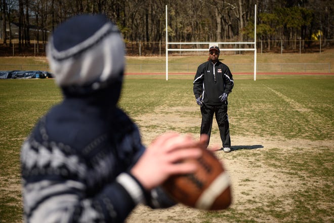 Earl Harvey, right, works with Ray Moran on Wednesday, March 15, 2017, at Reid Ross Classical School. Harvey is the new football coach for the Sandhills Titans, a football program for kids who are being home schooled, or for some reason may not be eligible for public or private high school play. [Staff Photo by Andrew Craft]
