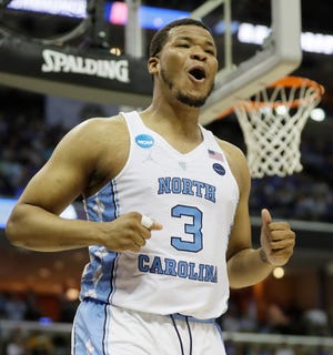 North Carolina forward Kennedy Meeks (3) reacts to play under the basket against Kentucky in the first half of the South Regional final game in the NCAA college basketball tournament Sunday, March 26, 2017, in Memphis, Tenn. (AP Photo/Mark Humphrey)