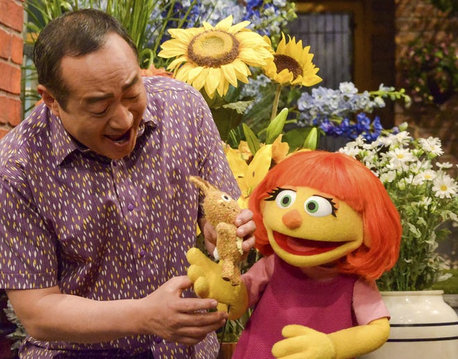 Julia, right, is a new autistic muppet character that will debut in the upcoming 47th season of "Sesame Street." Her first show will air April 10, 2017, on PBS and HBO. 



(Sesame Workshop via AP / Zach Hyman)