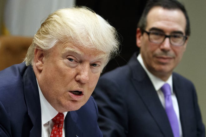 Treasury Secretary Steven Mnuchin listens at right as President Donald Trump speaks during a meeting on the Federal budget Feb. 22, 2017, in the Roosevelt Room of the White House in Washington. Trump wants to tackle tax reform, but the loss on health care deals a blow to that effort. The loss on health care deprives Republicans of $1 trillion in tax cuts, and the GOP is just as divided on what steps to take. (AP File Photo/Evan Vucci, File)