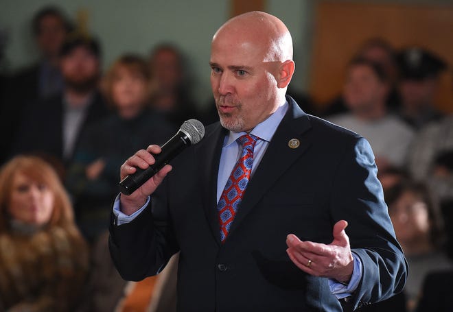 (File) U.S. Rep. Tom MacArthur, R-3rd of Toms River, answers questions from the audience during a town hall meeting at the Waretown Volunteer Fire Co. Station 36 in Ocean County on March 6.