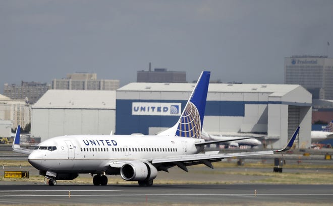 FILE - In this Sept. 8, 2015, file photo, a United Airlines passenger plane lands at Newark Liberty International Airport in Newark, N.J. United said on Monday, March 27, 2017, that regular-paying fliers are welcome to wear leggings aboard its flights, even though two teenage girls were barred by a gate agent from boarding a flight from Denver to Minneapolis Sunday because of their attire. (AP Photo/Mel Evans, File)