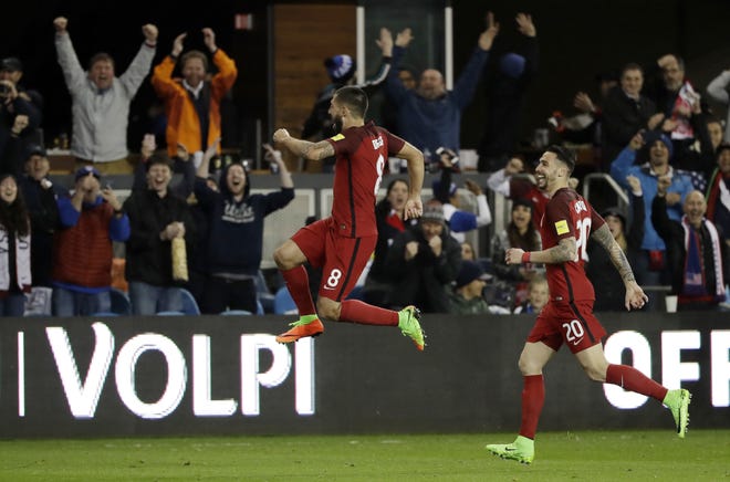 United States' Clint Dempsey, center, celebrates his free-kick goal with teammate Geoff Cameron, right, during the second half of a World Cup qualifying soccer match against Honduras on Friday in San Jose, Calif. [AP Photo / Marcio Jose Sanchez]