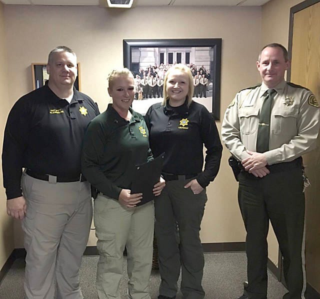 Left to right: Dallas County Chief Deputy Doug Lande, Sgt. Kimberly Johnson, jail Lt. Heather Roll and Sheriff Chad Leonard. Johnson was recently promoted to the rank of sergeant in the Dallas County Jail. PHOTO CONTRIBUTED BY THE DALLAS COUNTY SHERIFF’S DEPARTMENT