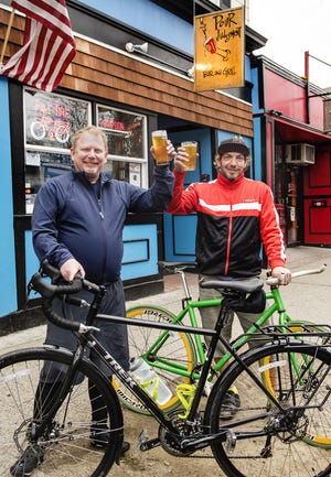 Hank Whitin, left, co-owner of Pour Judgement on Broadway, and Joe Sweetland of Newport will begin their Bikes and Beers Across America ride May 21 in Astoria, Oregon.
