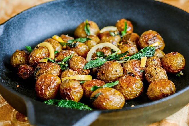 Roasted white potatoes with mint and preserved lemon. [Photo by Andrew Rush, Post-Gazette]