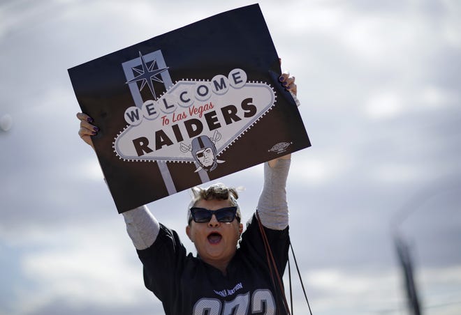 Labor union member Geraldine Lacy celebrates Monday, March 27, 2017, in Las Vegas. NFL team owners approved the move of the Raiders to Las Vegas in a vote at an NFL football annual meeting in Phoenix. THE ASSOCIATED PRESS