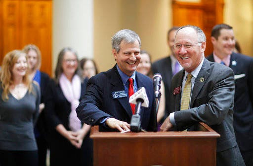 Georgia Sen. Ben Watson, R - Savannah, left and Rep. Allen Peake, R - Macon, speak during a press conference on a bill opening a popular medical marijuana program to more patients at the Capitol in Atlanta, Tuesday, March 28, 2017. The House approved a bill Tuesday that would add six new diagnoses to the list of qualifying conditions for medical cannabis oil, including autism, AIDS, Tourette’s syndrome, and Alzheimer’s disease. The bill will have to pass the Senate before moving to the governor who has signaled his approval of the limited program expansion. (AP Photo/David Goldman)