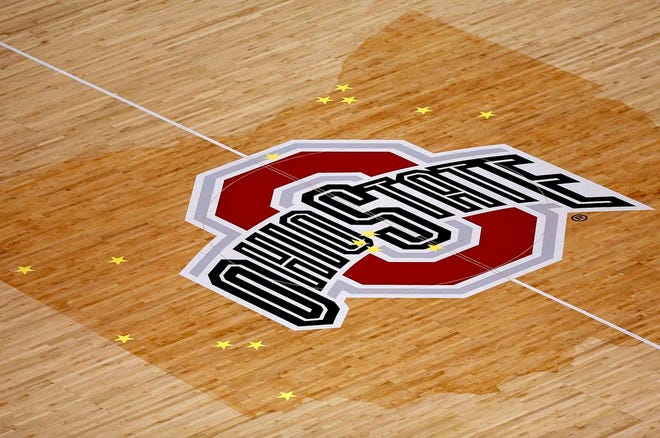 Vinyl stars are placed at center court on the state of Ohio outline for the 16 high school boys basketball teams participating in the OHSAA Boys Basketball State Tournament this weekend. Placing the stars on the court started with the girls tournament and is expected to become an annual tradition.