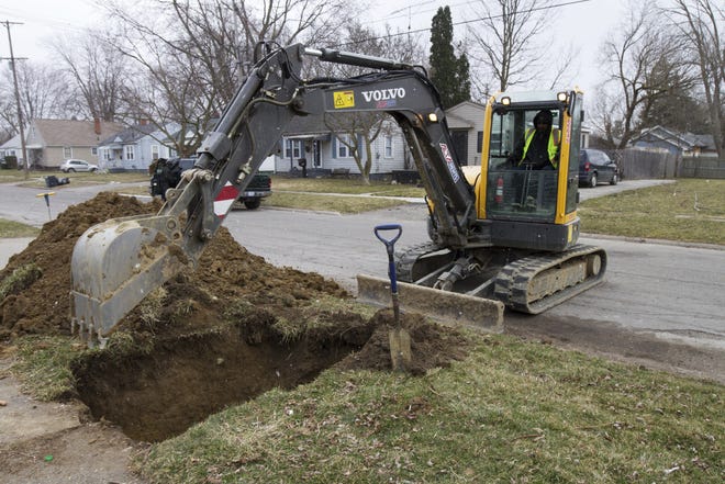 In a photo from March 10, 2017, work continues on the water replacement lines in Flint, Mich. Flint residents could still be a few years away from drinking unfiltered tap water as the city makes incremental progress on an ambitious timeframe to replace old water service lines that leached lead into homes and businesses. The project's coordinator said he has a goal of finishing the pipe replacements for residents in 2019 by fixing 6,000 service lines a year. AP