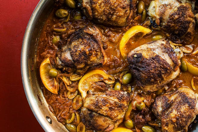 This February 2017 photo shows braised chicken with green olives and onions in New York. This dish is from a recipe by Katie Workman. (Sarah Crowder via AP)
