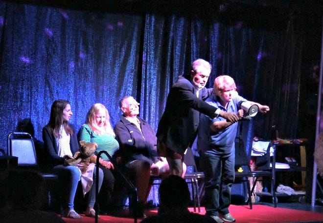 Terry Stokes Sr. hypnotizes an audience member at "The Stoked Show." [SPECIAL TO THE DAILY NEWS]