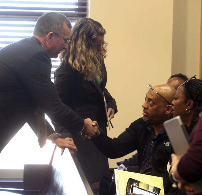 Special Prosecutor Brad King, left, meets the family of Sade Dixon during Markeith Loyd’s status hearing Monday in Orlando. [RED HUBER/ORLANDO SENTINEL VIA AP]
