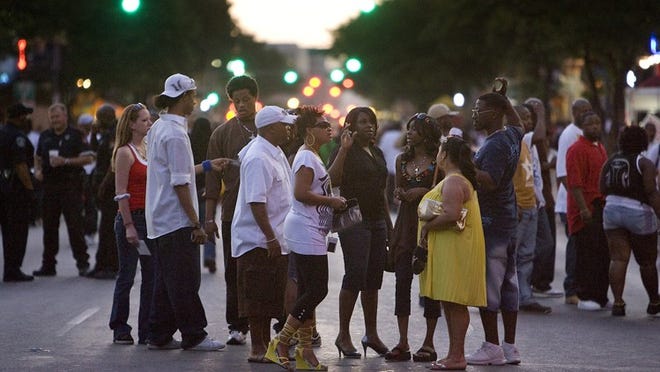 Large crowds gathered on East Sixth Street in 2009 after the Texas Relays track and field event ended.