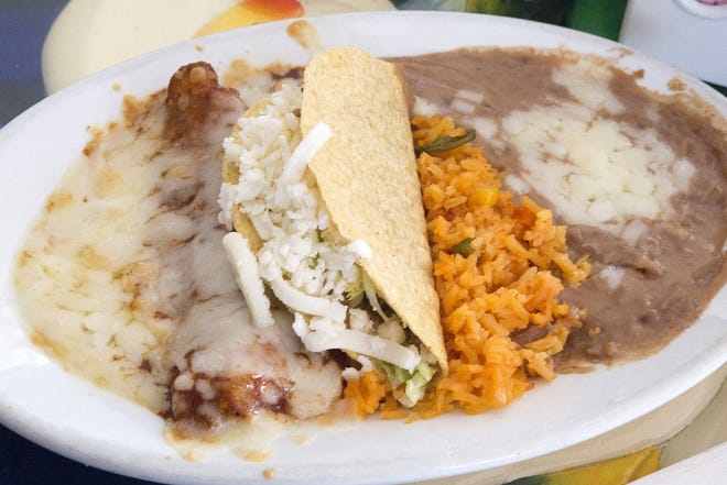 This combination platter lunch special comes with one enchilada, one taco, rice and beans for $6.50 at El Ranchito in Leesburg. [CINDY DIAN / CORRESPONDENT]