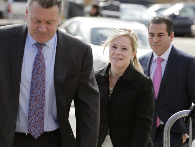 Bridget Kelly, center, arrives for sentencing at federal court in Newark, N.J., Wednesday, March 29, 2017. Kelly and Bill Baroni, former aides to New Jersey Gov. Chris Christie, are scheduled to be sentenced Wednesday for their roles in the 2013 George Washington Bridge lane-closing scandal. (AP Photo/Seth Wenig)