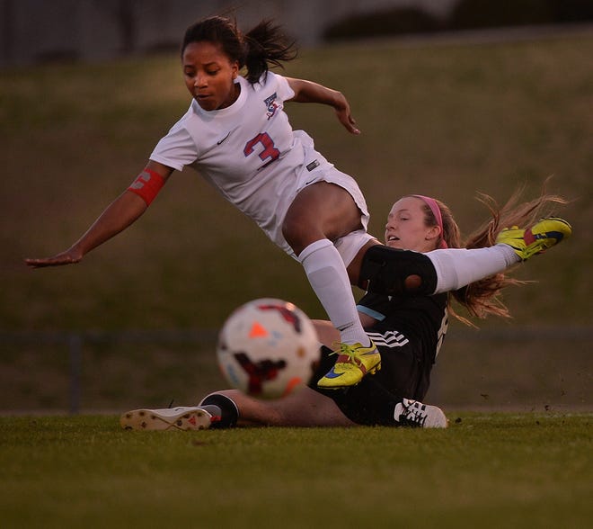 Byrnes' Kayla Dendy (3) battles for the ball against Dorman's Grace Cardew (18) during Region III-5A soccer action Wednesday night in Duncan. [TIM KIMZEY/Spartanburg Herald-Journal]