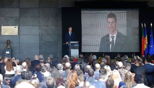 Real Madrid's Cristiano Ronaldo gives a speech at the Madeira international airport outside Funchal, the capital of Madeira island, Portugal, Wednesday March 29, 2017. Madeira International Airport has been renamed after local soccer star Cristiano Ronaldo on Wednesday during a ceremony, with family, at the airport outside his Funchal hometown.