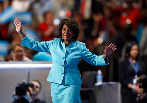 FILE - In this July 27, 2016, file photo, U.S. Rep. Maxine Waters, D-Calif., takes the stage to speak during the third day of the Democratic National Convention in Philadelphia. Activist Brittany Packnett encouraged people to tweet under #BlackWomenAtWork Tuesday, March 28, 2017. It’s a response to O’Reilly’s comment Tuesday that Democratic U.S. Rep. Maxine Waters’ hair was a "James Brown wig." He later apologized. (AP Photo/Paul Sancya, File)