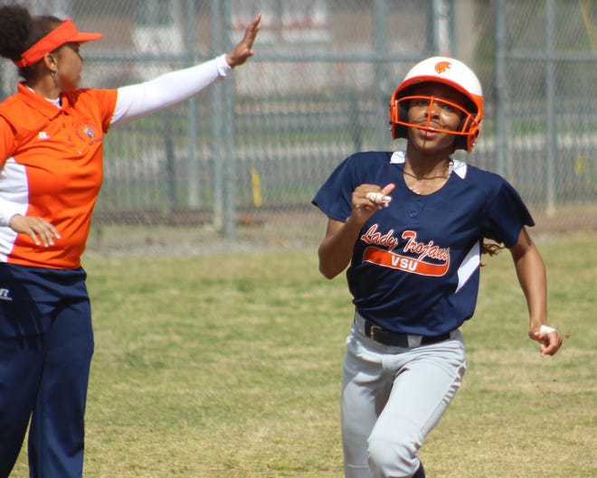 Virginia State Softball's Ayannah Bowman (right) rounds third base on her way home to score after teammate Dominique Mulero (not pictured) hit a double. [Nicholas Vandeloecht/progress-index.com]