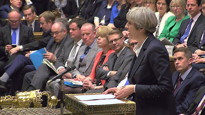 Britain's Prime Minister Theresa May gives news of triggering the Article 50 clause to initiate Britain's separation from the European Union, inside the House of Commons in London in this image taken from video Wednesday March 29, 2017. THE ASSOCIATED PRESS