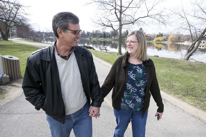 Rockford couple Ziyad and Kathy Shihadah said they have made their interfaith marriage work by focusing on their spiritual ties with God rather than tradition and culture. They were photographed walking along the Rock River on Tuesday, March 28, 2017. [ARTURO FERNANDEZ/RRSTAR.COM STAFF]