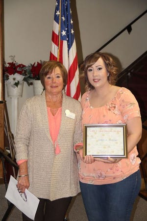 Jaymee McKeown earned the Live Your Dream Award along with a $1,000 scholarship. McKeown works as the children and families outreach coordinator at the HUB Communities Family Resource Center in Montague. She is pictured here with Soroptimist Susan Reather.