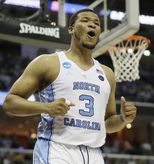 Forward Kennedy Meeks played a crucial role in North Carolina's win over Kentucky last weekend, blocking four shots and sliding around the lane to help plug openings created by Wildcats coach John Calipari's dribble-drive motion offense. [MARK HUMPHREY/THE ASSOCIATED PRESS]