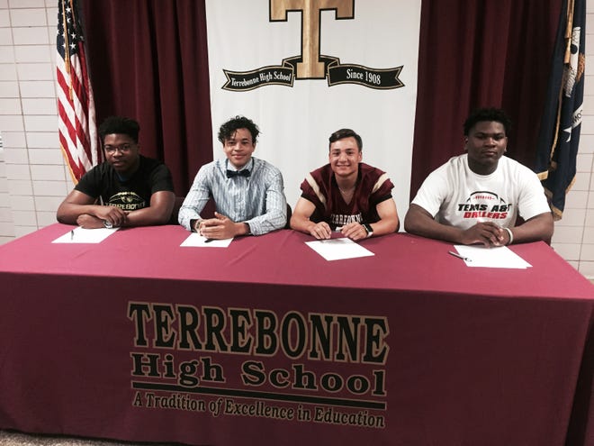 Terrebonne football players Jean-Francois Kouame (from left), Deshon Frye, Tristan Duplantis and Cannan Harris all signed national letters-of-intent on Thursday. [Chris Singleton/Staff -- HOUMATODAY/DAILYCOMET]