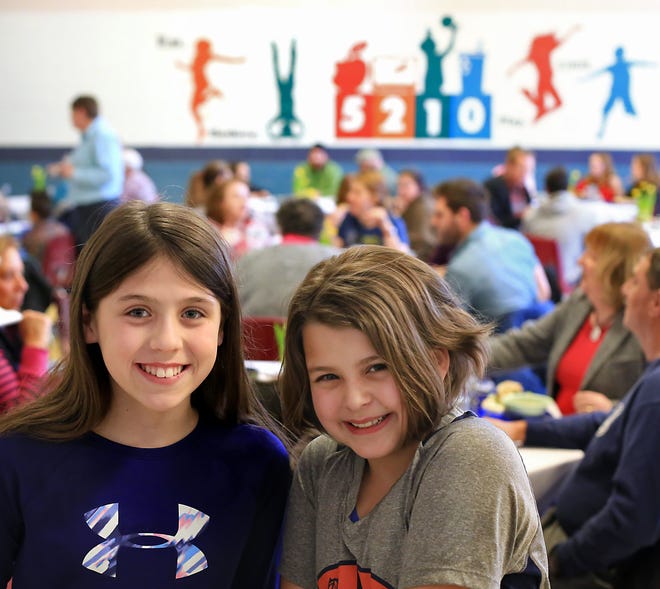 Shapleigh School students including fifth graders Emily Housley, left, and Marie Lane hosted an Empty Bowls dinner last week to raise awareness about hunger within the local community.[Ioanna Raptis/Seacoastonline]
