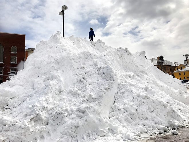 Conner Konecci 7, of Kittery, Maine, climbs to the top of a snow mountain in the Worth Lot along Maplewood Aveue in Portsmouth on Wednesday, March 15, 2017.
[Rich Beauchesne/Seacoastonline, file]