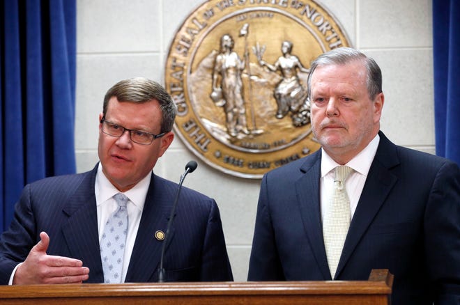 FILE - In this Tuesday, March 28, 2017 file photo, Republican leaders Rep. Tim Moore, left, and Sen. Phil Berger, hold a news conference in Raleigh, N.C. North Carolina Republican lawmakers said Wednesday night that they have an agreement with Democratic Gov. Roy Cooper on legislation to resolve a standoff over the state's "bathroom bill." Details about the replacement weren't immediately available, Moore and Berger declined to take questions during a brief news conference. (Chris Seward/The News & Observer via AP, File)