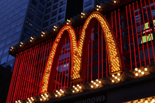 FILE - This Sunday, Jan. 10, 2016, photo shows the sign at the McDonald's restaurant on 42nd Street near Times Square in New York. McDonald's says it will swap frozen beef patties for fresh ones in its Quarter Pounder burgers by sometime in 2018 at most of its U.S. locations. Employees will cook up the never-frozen beef on a grill when ordered. (AP Photo/Gene J. Puskar, File)