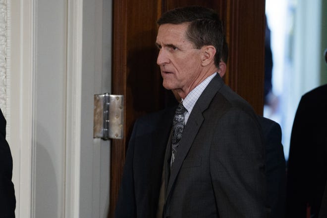FILE - In this Feb. 13, 2017 file photo, Mike Flynn arrives for a news conference in the East Room of the White House in Washington. Flynn´s attorney says the former national security adviser is in discussions with the House and Senate intelligence committees on receiving immunity from “unfair prosecutionÓ in exchange for questioning. Flynn attorney Robert Kelner says no “reasonable personÓ with legal counsel would answer questions without assurances. (AP Photo/Evan Vucci, File)