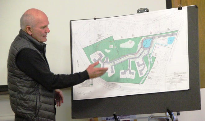Michael Biszko shows a rendering of the proposed eight house lot development off Warhurst Avenue in Swansea. PHOTO BY BILL HALL/THE SPECTATOR/SCMG