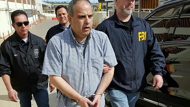 Federal agents with the FBI and Customs and Border Patrol escort Robert Van Wisse at the Texas-Mexico border in Laredo as he is taken into custody in January. Van Wisse sexually assaulted and killed an Austin woman in 1983 but was brought back to the U.S. to face charges after fleeing to Mexico. FBI