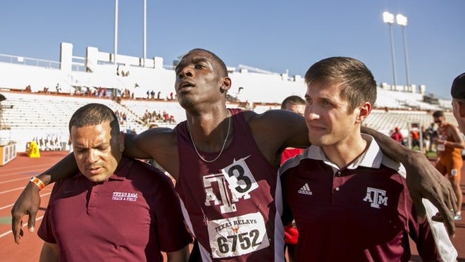 Lindon Victor of Texas A&M is helped off the field after he collapsed at the finish line of the 1500 meter run portion of the decathlon at the 90th Clyde Littlefield Texas Relays at Mike A. Myers Stadium on Thursday March 30, 2017. Victor set a new collegiate record in the decathlon. JAY JANNER / AMERICAN-STATESMAN