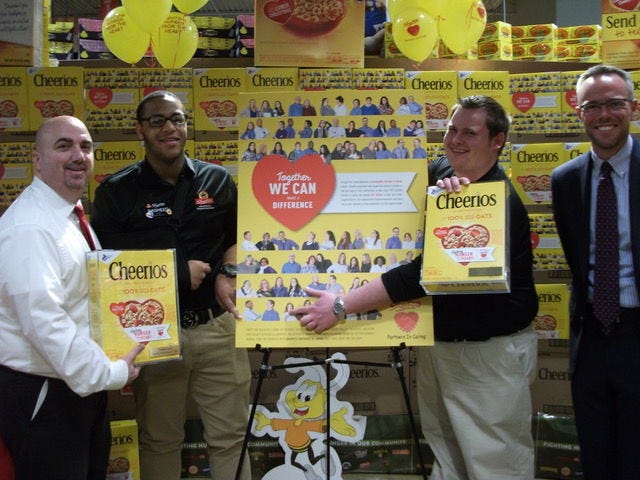 At the unveiling of the limited edition Cheerios box are ShopRite of Burlington Store Director Jim Dolman (from left), Nasheed Steen, of Willingboro, Bill Trefz, of Mount Holly, and store owner Geoffrey Eickhoff.