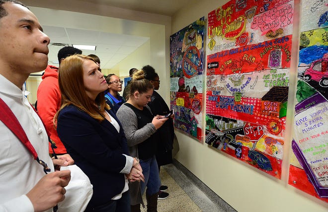 Driver's education students at Burlington City High School check out the safe driving mural created by the sophomore class and unveiled Friday, March 31, 2017.