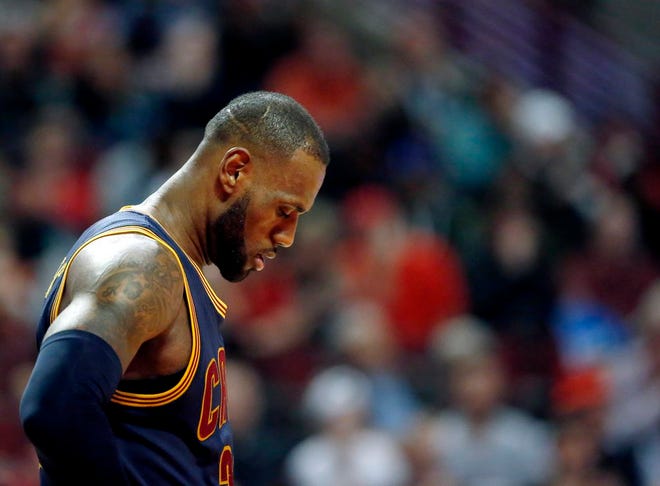 Cleveland forward LeBron James looks down during the Cavaliers' 99-83 loss to the Chicago Bulls in an NBA basketball game Thursday, March 30, 2017, in Chicago.The Cavs matched a season high with their third straight loss and are 6-10 in the month of March.