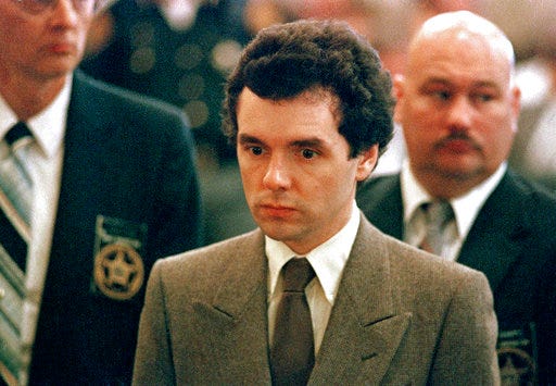 FILE – In this Sept. 1987 file photo, serial killer Donald Harvey stands before a judge during sentencing in Cincinnati.  Harvey, who was serving multiple life sentences, was found beaten in his cell Tuesday afternoon at the state's prison in Toledo, state officials said. He died Thursday morning, said JoEllen Smith, spokeswoman for Ohio's prison system. He was 64. (AP Photo/Al Berhman, File)