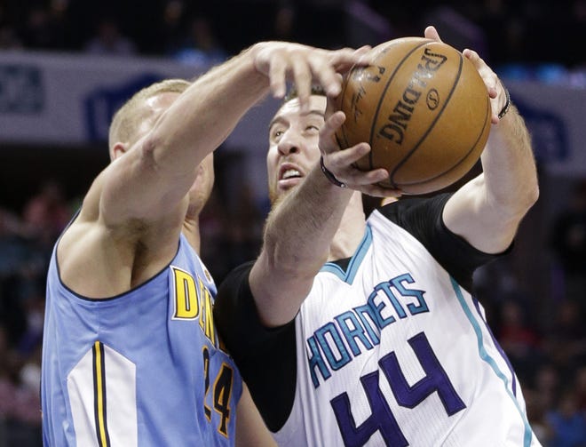 Charlotte Hornets' Frank Kaminsky (44) drives against Denver Nuggets' Mason Plumlee in the first half of Friday night's game in Charlotte. [AP Photo/Chuck Burton]