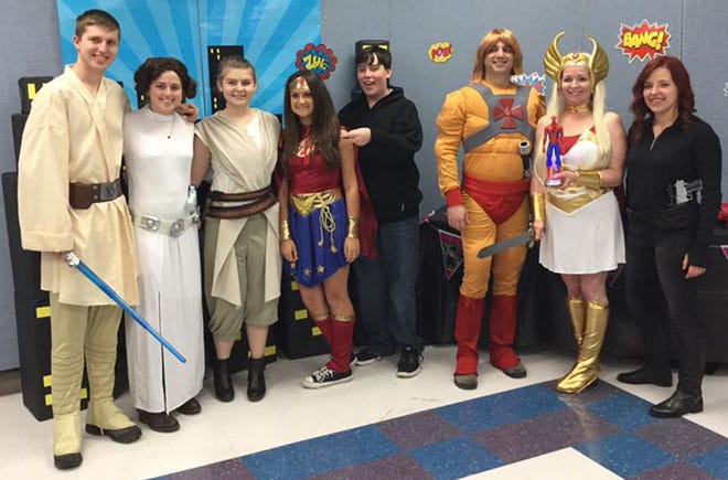 Members of the Resistance team were winner of the team costume contest during the third annual Trivia Night competition held to beenfit the Pervasive Parenting Center. The team was made up primarily of

students from Panama schools. [PHOTO COURTESY PERVASIVE PARENTING CENTER]