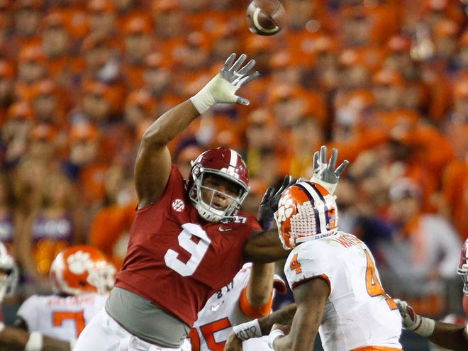 Alabama defensive lineman Da'Shawn Hand (9) tries to block a pass by Clemson quarterback Deshaun Watson during the College Football Playoff National Championship game in Raymond James Stadium in Tampa on Monday, Jan. 9, 2017. [Staff Photo/Gary Cosby Jr.]