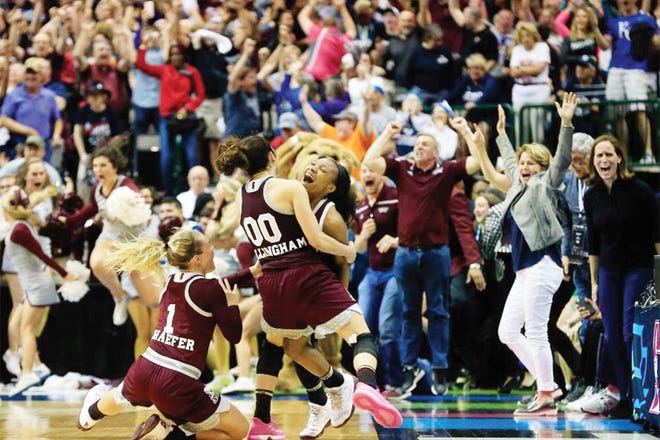DO YOU BELIEVE IN MIRACLES? — Mississippi State players, coaches and fans begin to celebrate the Bulldogs' upset of Connecticut, snapping the Huslies' 111-game winning streak.