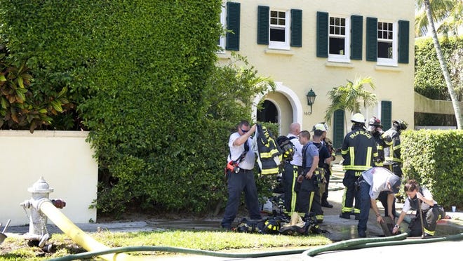 Palm Beach and West Palm Beach firefighters respond to a fire at 160 Seabreeze on Saturday. Meghan McCarthy / Daily News)