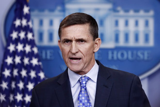 National Security Adviser Michael Flynn speaks during the daily news briefing Feb. 1 at the White House, in Washington. Donald Trump says his former national security adviser is right to ask for immunity in exchange for talking about Russia. [AP Photo/Carolyn Kaster]
