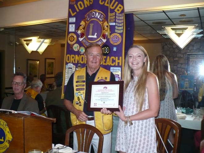 Ormond Beach Lion Tom Millen presents Samantha Harrison, member of Seabreeze High School's tennis team, with a certificate, honoring her as the Student-Athlete of the Month by the club's March meeting. Harrison has a 4.11 GPA, ranks 28th in the Class of 2017, and a member of Gold Bright Futures. She is a four-year varsity tennis player and serves as team captain. She has received the Coach's Award and has been named team MVP. Principal Joe Rawlings characterized Harrison as leader, a goal setter and achiever. She will attend the University of Florida where she will major in management. She subsequently plans to attend Law School and is focused on a career in contract law for the NFL. [Photo provided]